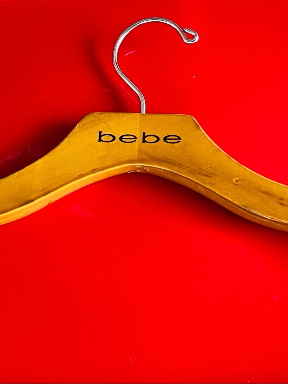 bebe Wooden Clothing Hanger in Yellow with Metal Hook